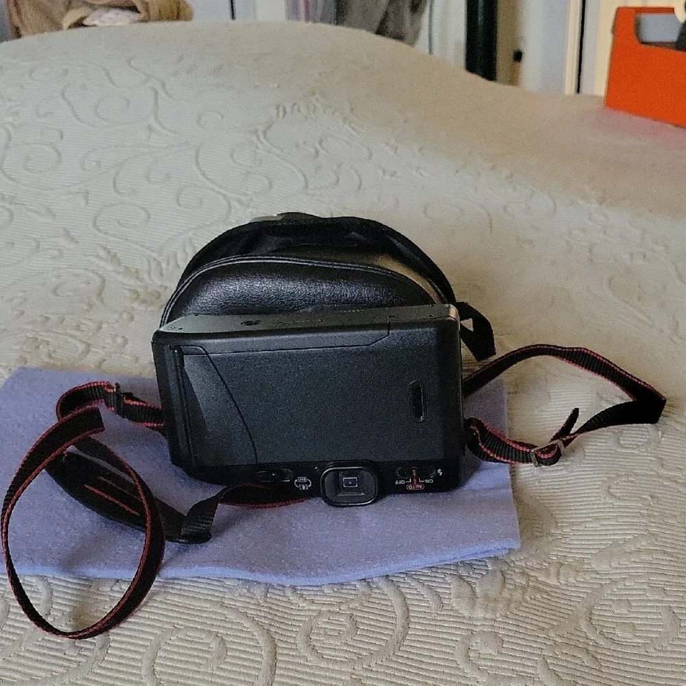 Canon Vintage Black Film Camera with Red Accents